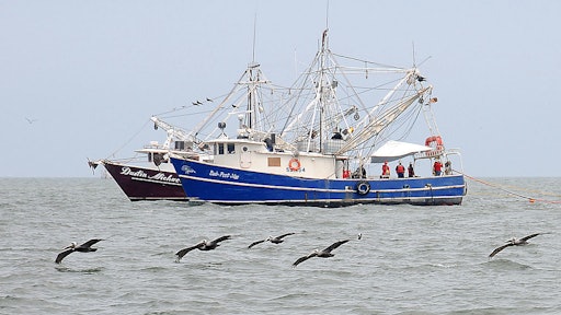 1024px Shrimp boats tow fire resistant oil containment boom in Gulf of Mexico 2010 05 03 2 597797e6e5dc7