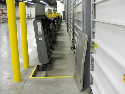 Essential to a drive-through dock, the vertical storing leveler improves security at the loading dock by minimizing the points of entry into the facility with the door closed to the pit floor.