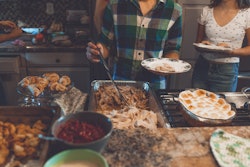 Person Picking Food On Tray 1631893