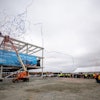 S.C. Ports COO Barbara Melvin (from left), Sen. Hugh K. Leatherman Sr., Jean Leatherman and S.C. Ports CEO Jim Newsome look on as the steel beam is placed on the new operations building at the Hugh K. Leatherman Sr. Terminal. More than 300 people, including port employees and construction partners, cheered as the streamers came down to celebrate the construction milestone. (Photo/Stephen Blackmon)