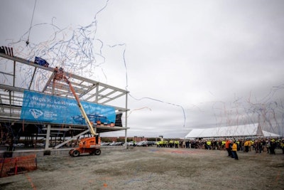 S.C. Ports COO Barbara Melvin (from left), Sen. Hugh K. Leatherman Sr., Jean Leatherman and S.C. Ports CEO Jim Newsome look on as the steel beam is placed on the new operations building at the Hugh K. Leatherman Sr. Terminal. More than 300 people, including port employees and construction partners, cheered as the streamers came down to celebrate the construction milestone. (Photo/Stephen Blackmon)