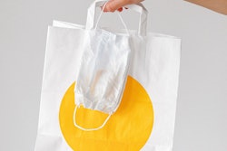 Person Holding Paper Bag And Face Mask 3987245