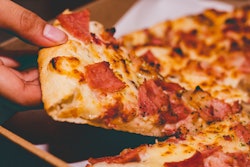 Close Up Photo Of Person Holding Pizza 1653877
