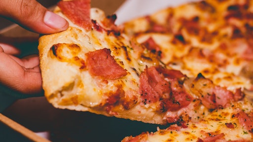 Close Up Photo Of Person Holding Pizza 1653877