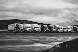 Parked Trucks Under Clouds 2348359