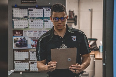 Man Holding Clipboard Inside Room 1543924