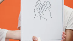 Person Holding A Poster On Proper Hand Washing 3952223
