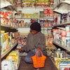Black Woman Selecting Products For Buying In Supermarket 4177709