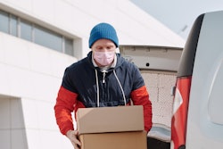 Delivery Man Wearing A Face Mask Carrying Boxes 4391479