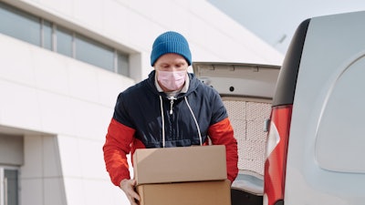 Delivery Man Wearing A Face Mask Carrying Boxes 4391479