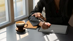 Person In Black And White Pinstripe Dress Shirt Using Tablet 3815573