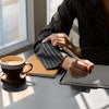 Person In Black And White Pinstripe Dress Shirt Using Tablet 3815573