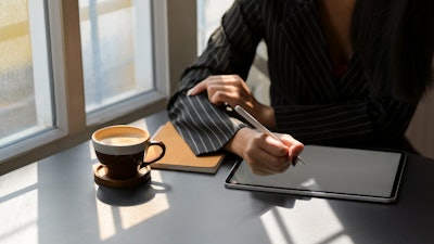 Person In Black And White Pinstripe Dress Shirt Using Tablet 3815573