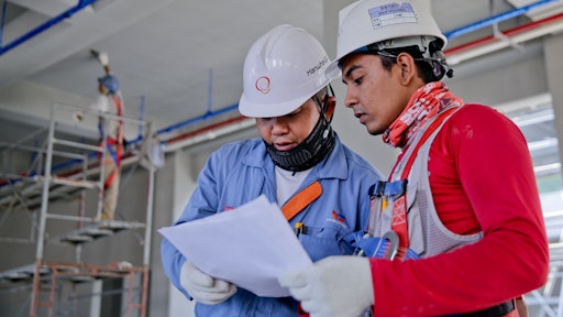 Two Man Holding White Paper 1216589