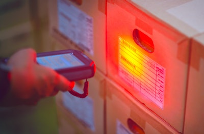Suthicha Adobe Stock Scanning Barcode In A Warehouse