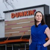 Liz Longstreet Darr stands outside of Dunkin', which National DCP serves.