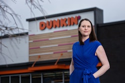 Liz Longstreet Darr stands outside of Dunkin', which National DCP serves.
