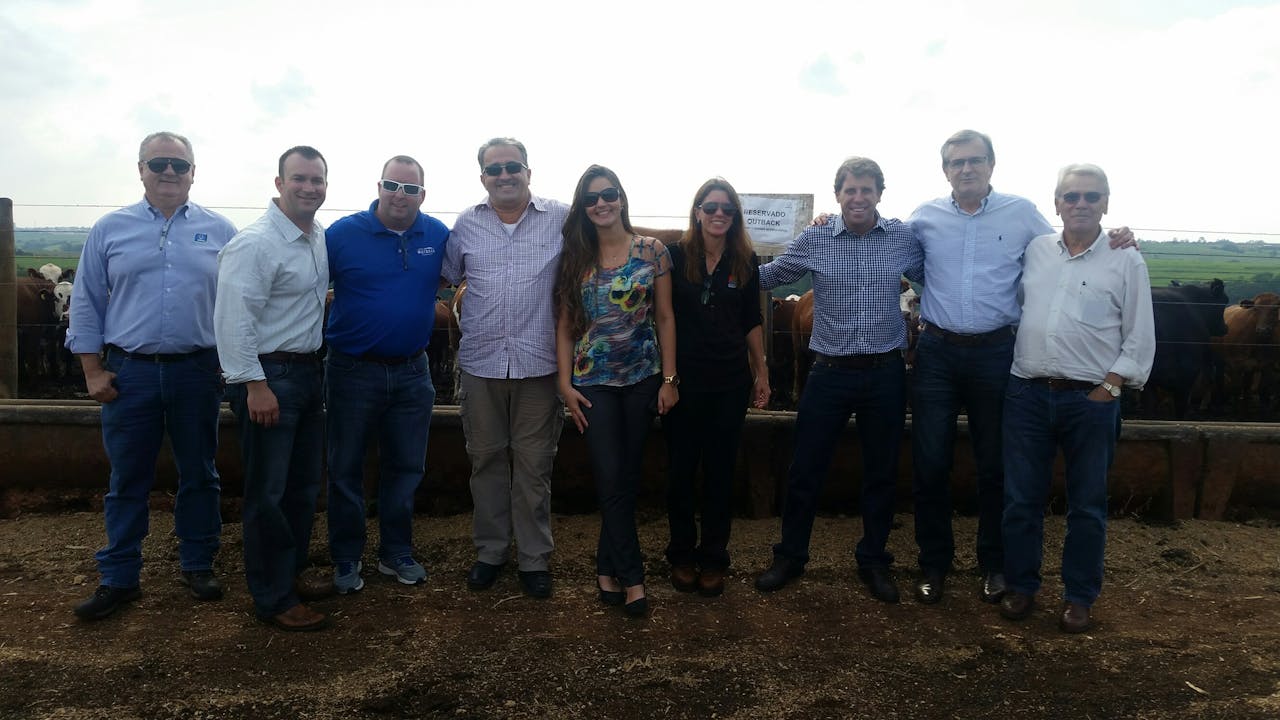 Lindy Miller (middle) stands with members of Bloomin Brands' quality assurance and supply chain teams as well as cattle farm and supplier personnel in Sao Paulo, Brazil.