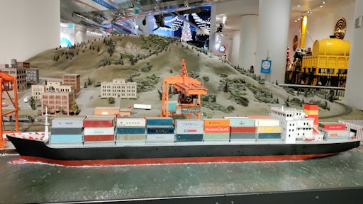 This is a picture of a ship and a crane at the Museum of Science and Industry in Chicago.