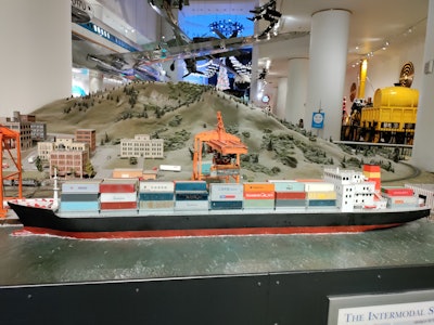 This is a picture of a ship and a crane at the Museum of Science and Industry in Chicago.