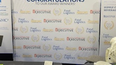 The backdrop of our booth for our awards winners.