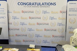 The backdrop of our booth for our awards winners.