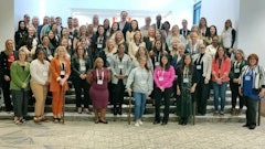 Attendees pose for a group photo.