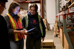 Routique Team In Warehouse Checking Inventory On Tablet