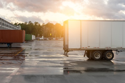 A truck awaits load at warehouse.