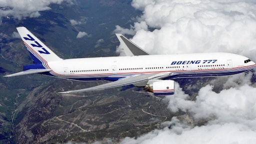Boeing 777 above clouds crop 58a72553a6c6f