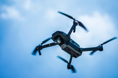 Photo Of Gray Quadcopter On The Sky 739410