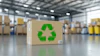 Cardboard box with green recycling symbol in warehouse storage facility