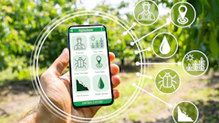 Hand holding smartphone displaying agriculture app with farming icons and crop management tools in field setting