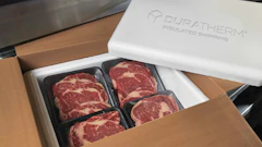 Puratherm insulated shipping box containing premium beef steaks in black trays
