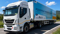 White IVECO refrigerated truck branded with NIVALIS cold chain logistics company branding, parked on a rural road with green landscape and blue sky.