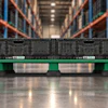 IFCO green plastic pallet with server equipment in warehouse with orange racking