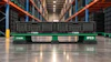 IFCO green plastic pallet with server equipment in warehouse with orange racking