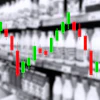 Candlestick chart with red and green bars showing financial market price movements overlaid on industrial warehouse background