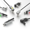 Collection of SICK industrial sensor connectors and M12 cable connectors in various configurations with black and gray housings