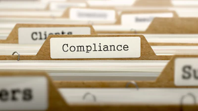 Compliance folder tab in organized file system with other labeled documents